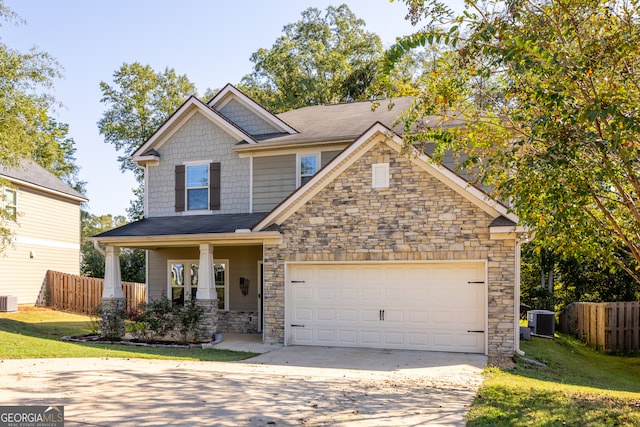 craftsman inspired home with a front lawn and central AC