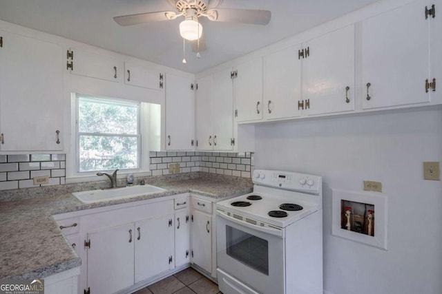 kitchen with white cabinetry, white electric range oven, and decorative backsplash