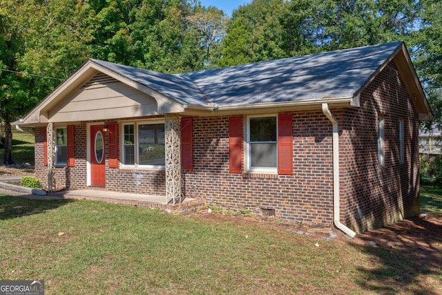 ranch-style home with a front lawn