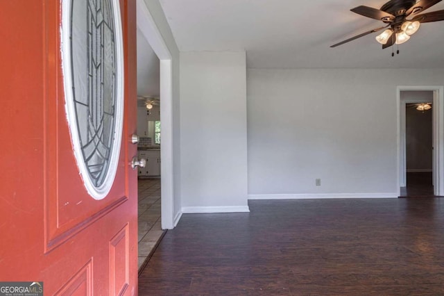 entryway with dark hardwood / wood-style floors and ceiling fan