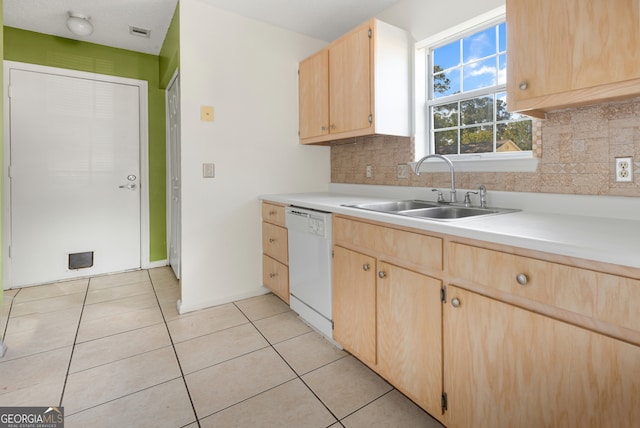 kitchen featuring dishwasher, light brown cabinets, backsplash, sink, and light tile patterned floors