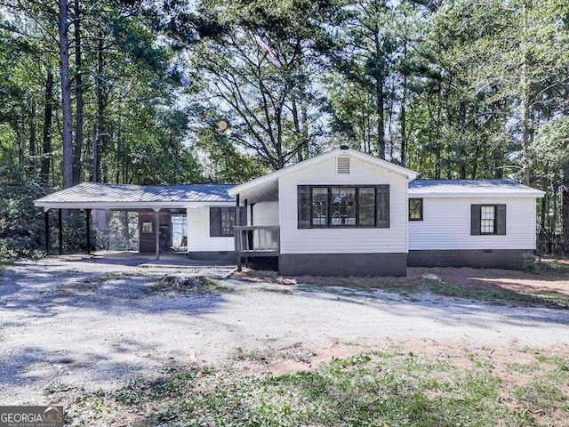 view of front of property with a carport