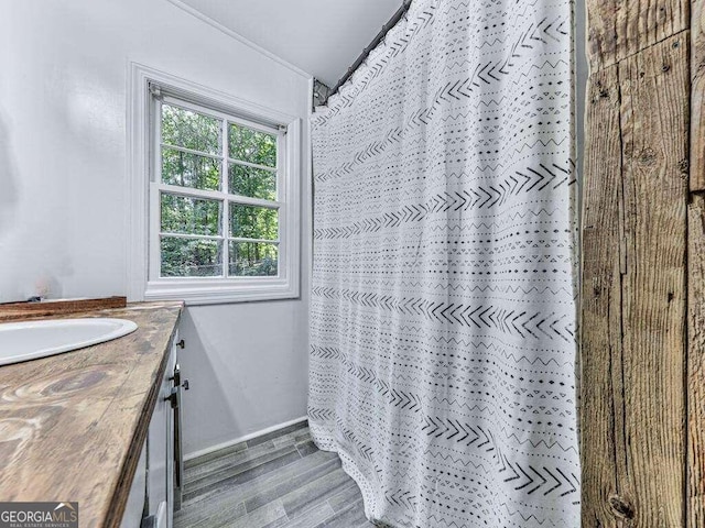 bathroom featuring vanity, a shower with shower curtain, and hardwood / wood-style floors