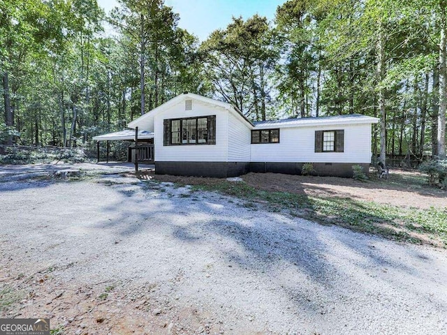 view of home's exterior with a carport