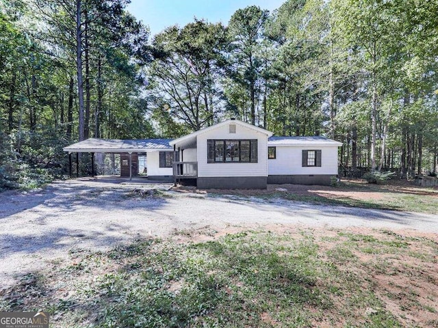 view of front of house featuring a carport