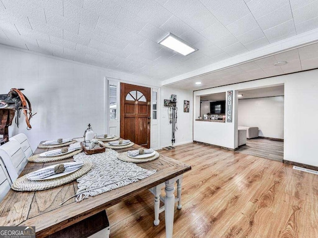 dining space with light wood-type flooring