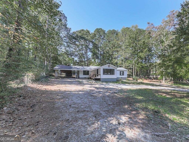 view of front of property with a carport