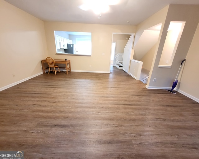 bonus room featuring dark hardwood / wood-style flooring