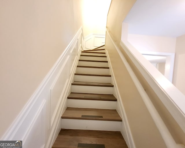 stairway featuring hardwood / wood-style floors