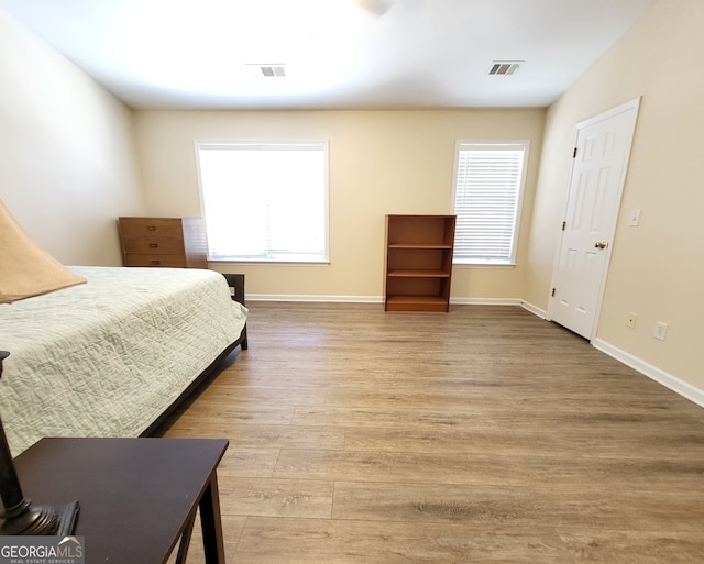 bedroom with light hardwood / wood-style floors