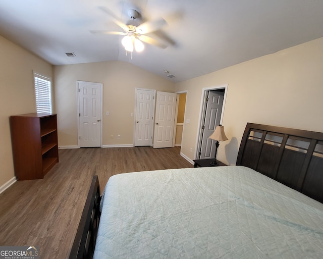 bedroom featuring lofted ceiling, hardwood / wood-style flooring, and ceiling fan