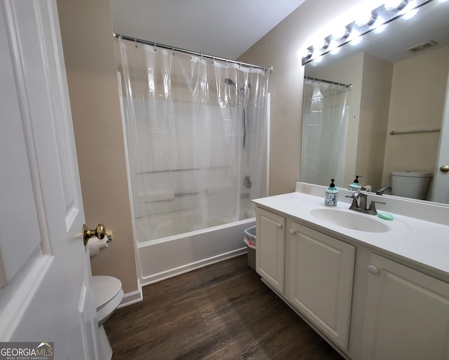 full bathroom with vanity, toilet, shower / bath combo with shower curtain, and wood-type flooring