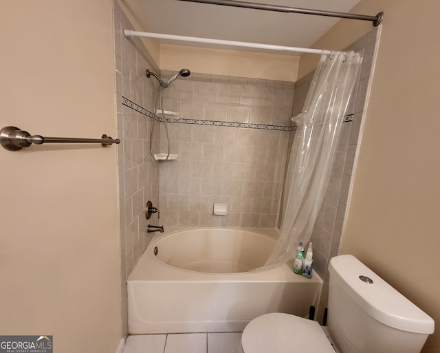 bathroom with tile patterned floors, shower / bath combination with curtain, and toilet