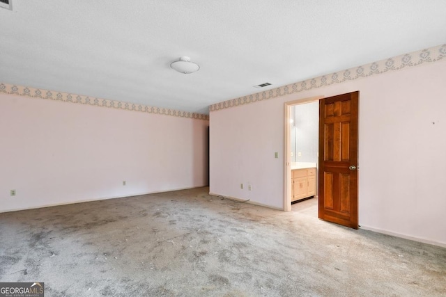 empty room with light colored carpet