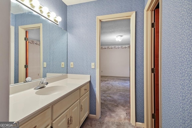 bathroom with vanity and a textured ceiling