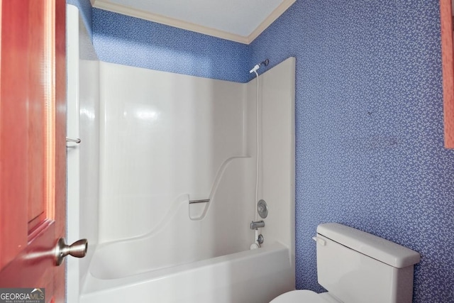 bathroom featuring  shower combination and toilet