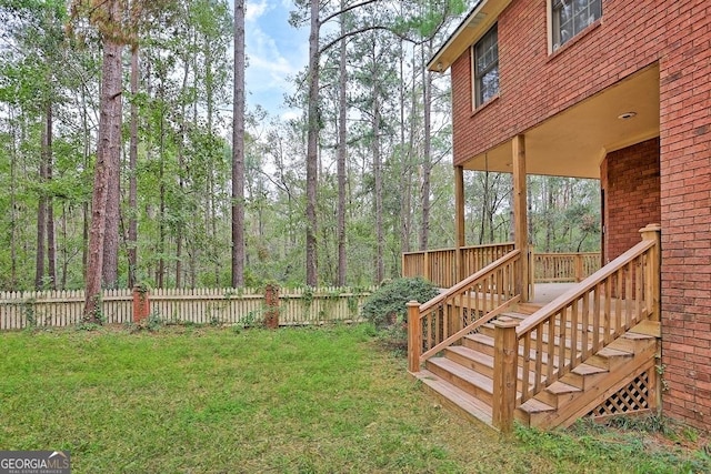 view of yard featuring a wooden deck