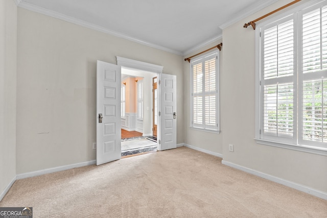 unfurnished bedroom with ornamental molding and light colored carpet