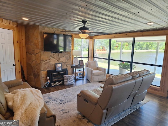 living room with wood ceiling, plenty of natural light, dark hardwood / wood-style floors, and ceiling fan