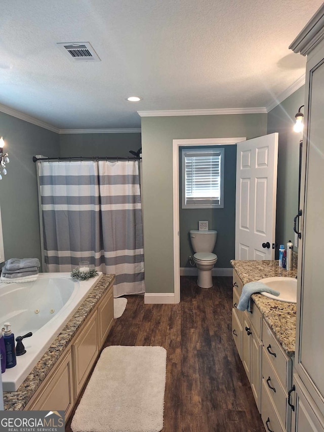 full bathroom featuring hardwood / wood-style flooring, crown molding, vanity, a textured ceiling, and toilet