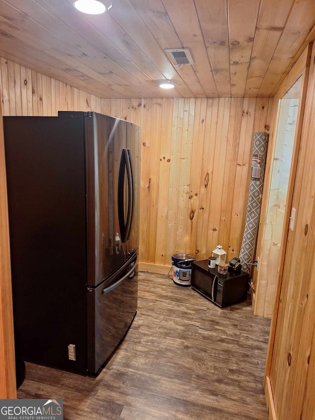 laundry area featuring wood-type flooring, wooden walls, and wood ceiling