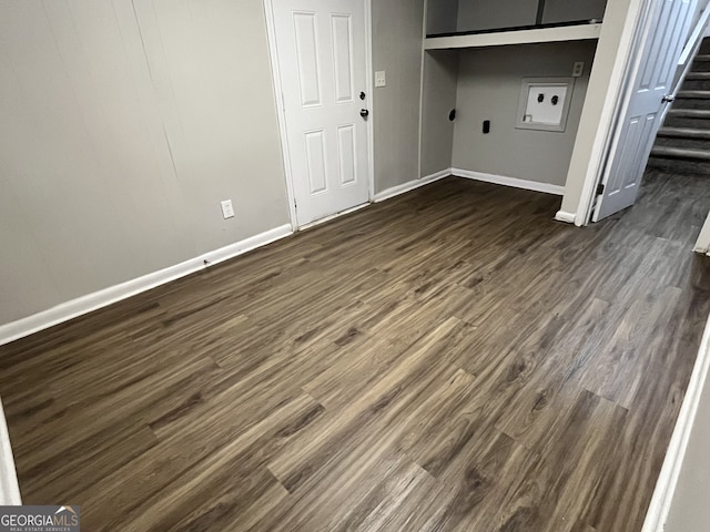 laundry area featuring washer hookup and dark hardwood / wood-style flooring