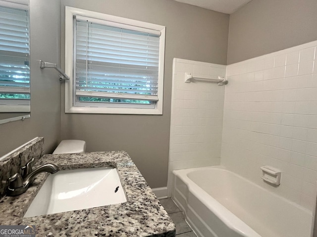 full bathroom with sink, tile patterned flooring, toilet, and shower / bathtub combination