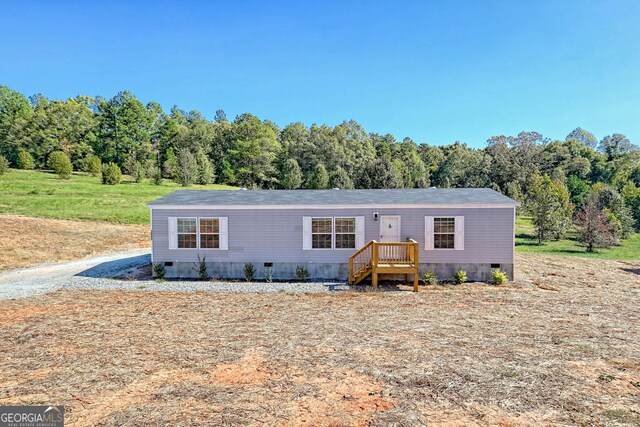 manufactured / mobile home featuring a wooden deck