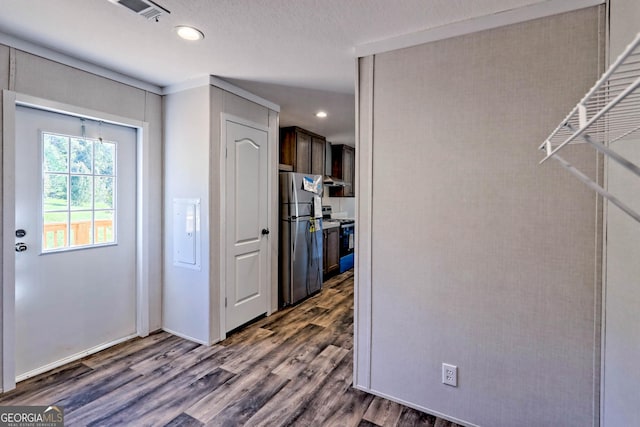 interior space featuring a textured ceiling and dark hardwood / wood-style flooring