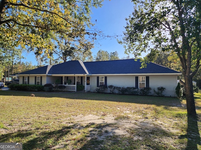 ranch-style house with a porch and a front lawn