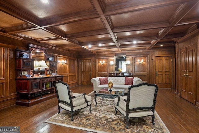 living room with dark hardwood / wood-style flooring, beamed ceiling, coffered ceiling, and wood walls