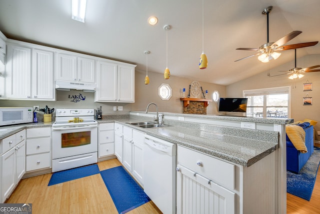 kitchen featuring light hardwood / wood-style flooring, sink, vaulted ceiling, and white appliances