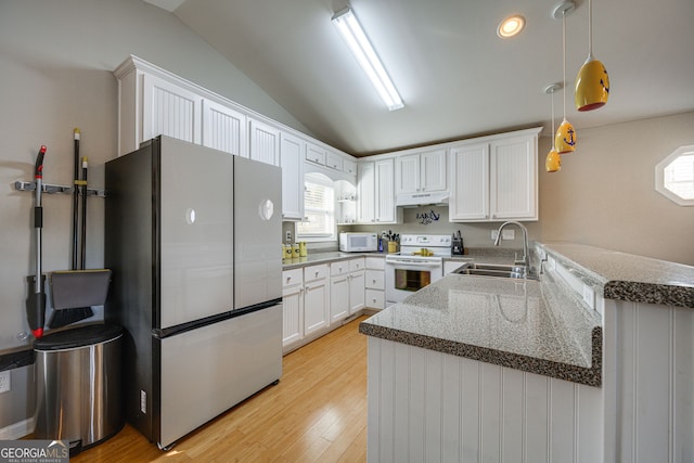 kitchen featuring kitchen peninsula, white cabinets, lofted ceiling, sink, and white appliances