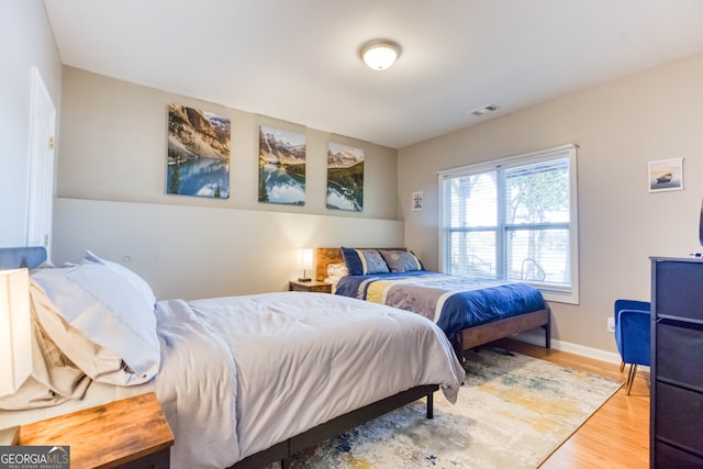 bedroom featuring hardwood / wood-style floors