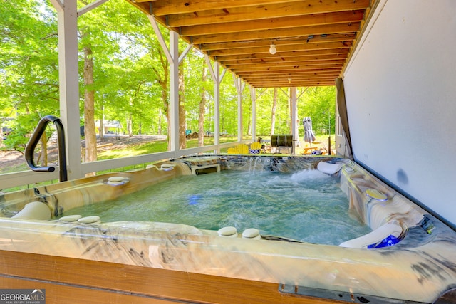 exterior space featuring a hot tub