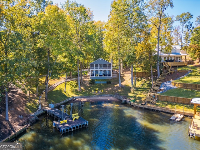 exterior space featuring a deck with water view