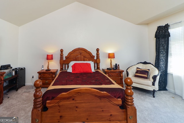 carpeted bedroom featuring lofted ceiling