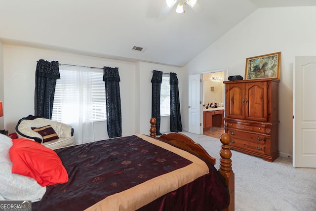 carpeted bedroom with lofted ceiling, ensuite bathroom, and ceiling fan