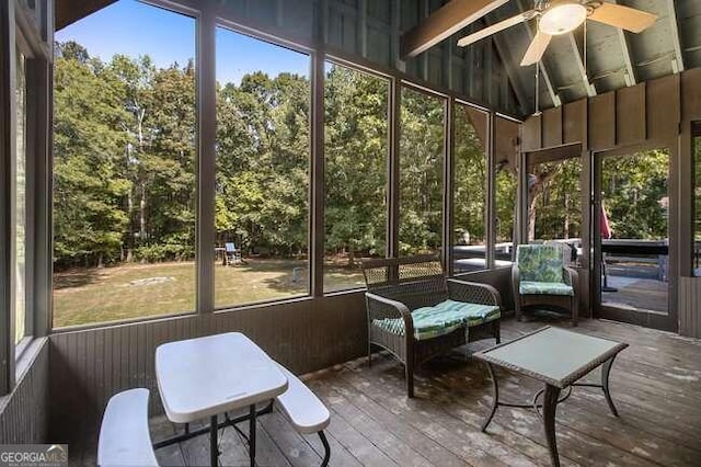 sunroom / solarium with vaulted ceiling and ceiling fan