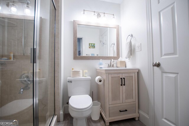 bathroom featuring vanity, tile patterned floors, and walk in shower