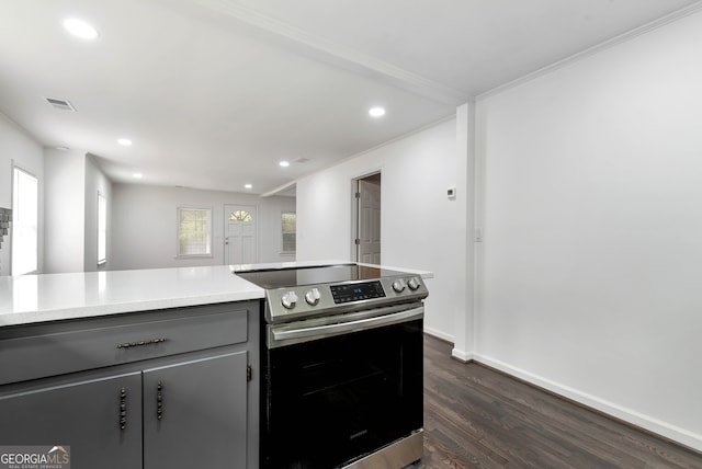 kitchen featuring gray cabinets, crown molding, electric range, and dark hardwood / wood-style flooring