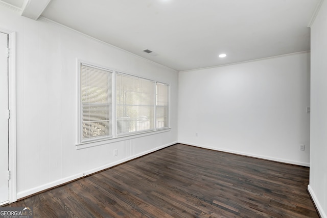 unfurnished room featuring crown molding, beam ceiling, and dark hardwood / wood-style flooring