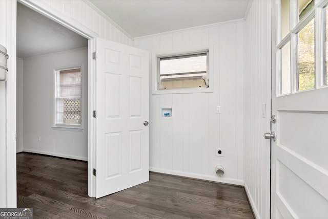 laundry area with ornamental molding, dark hardwood / wood-style floors, electric dryer hookup, and a wealth of natural light