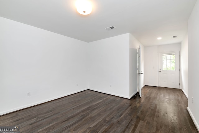 interior space with dark hardwood / wood-style flooring