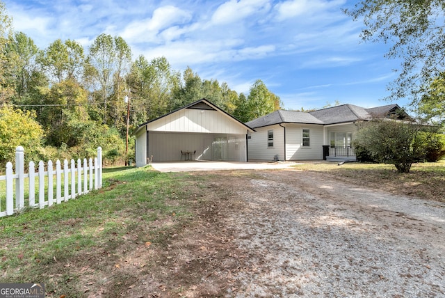 view of home's exterior with a patio area and a lawn