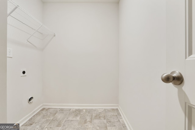 laundry room featuring light hardwood / wood-style flooring and electric dryer hookup