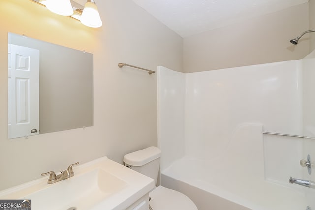 full bathroom with toilet, shower / tub combination, a textured ceiling, and vanity