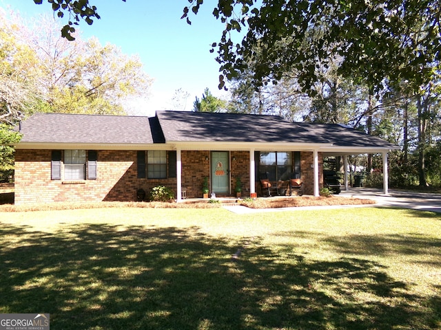 ranch-style home featuring a front yard