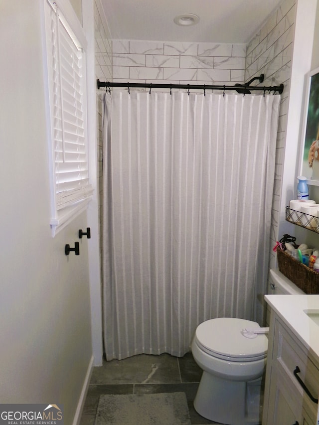 bathroom with vanity, a shower with curtain, and toilet