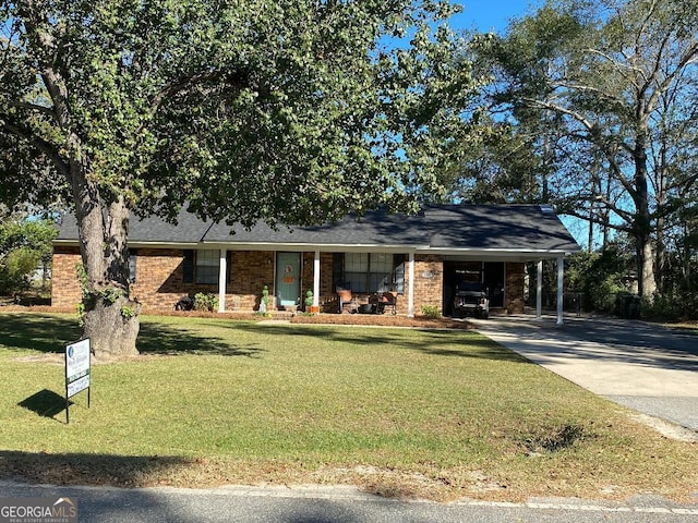 view of front facade featuring a front lawn and a carport